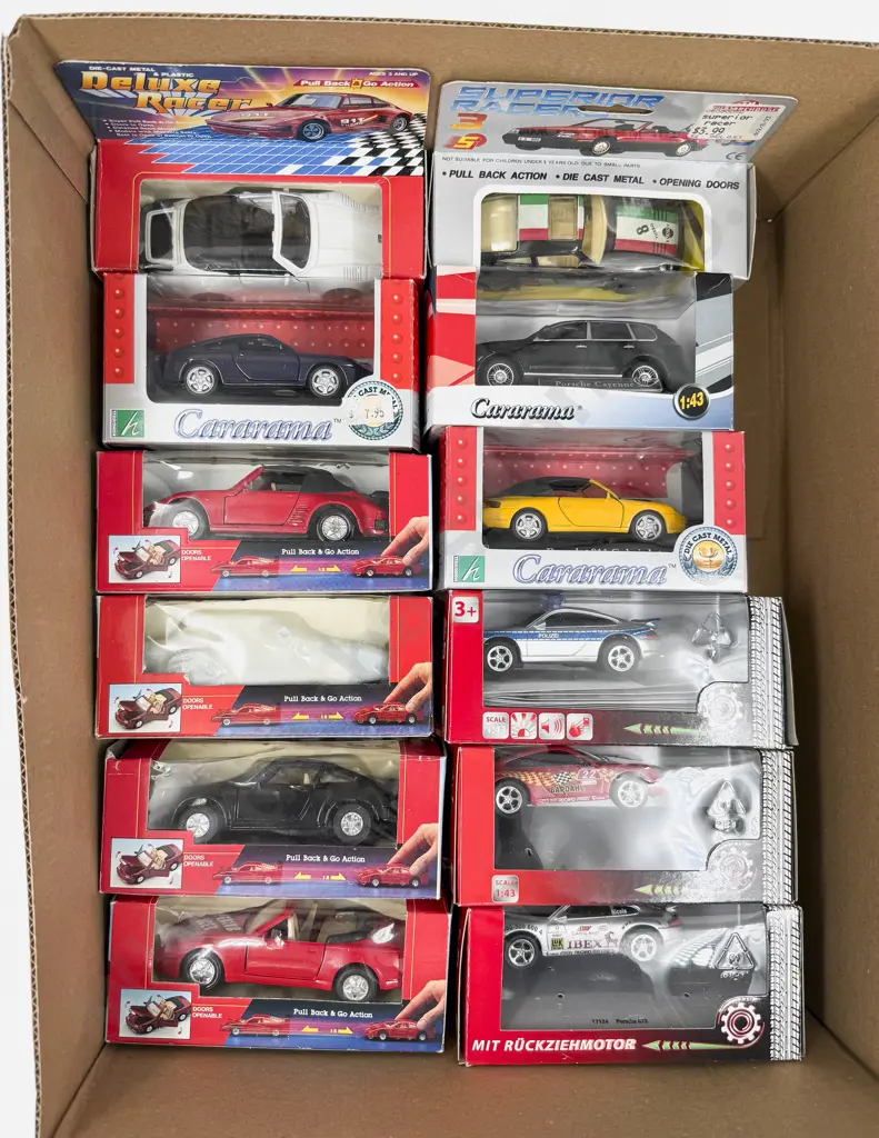 Twelve Boxed 1:43 Scale Porsche Models Image 1++