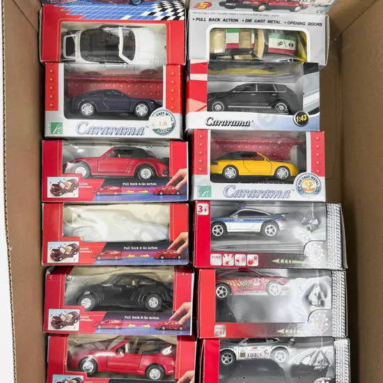 Twelve Boxed 1:43 Scale Porsche Models
