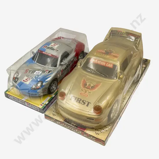 Two Large Plastic Boxed Porsche Models