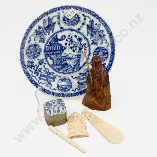 Three Pieces of Ivory on a Chinese Blue and White Plate and Two Others