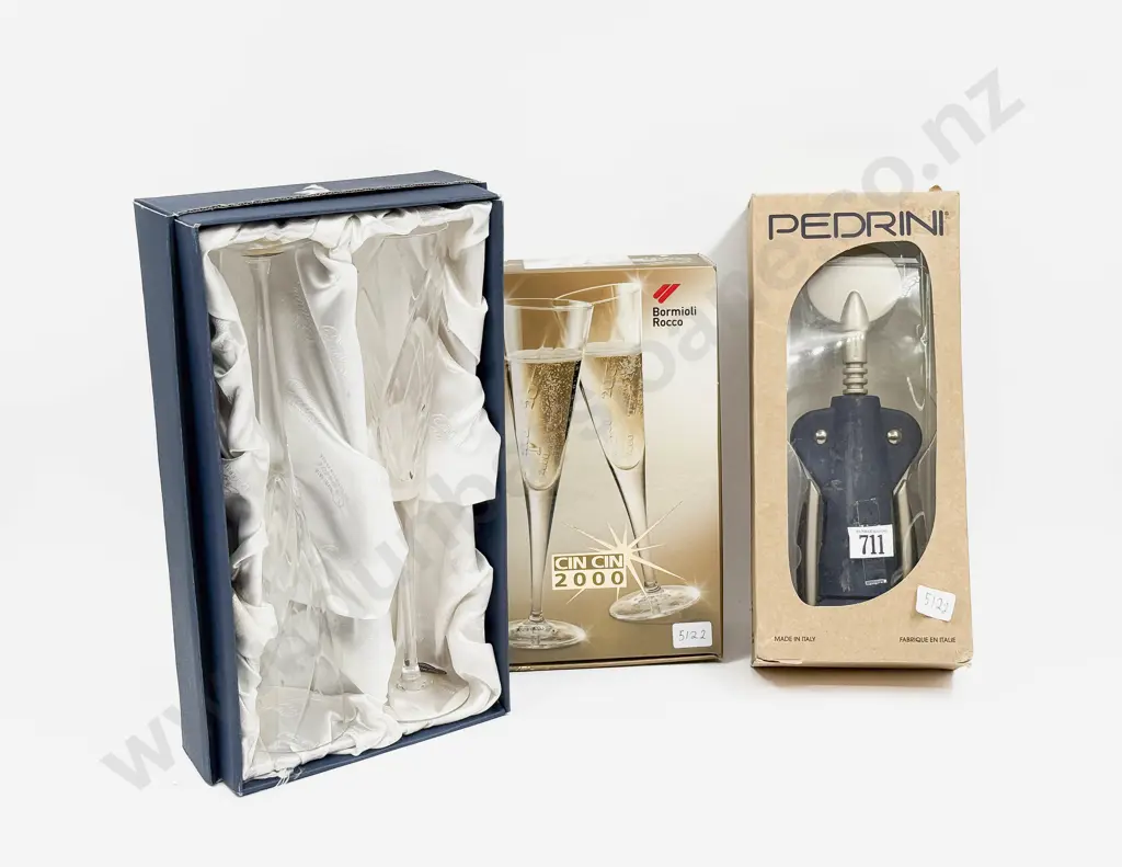 Two Boxed Champagne Glasses Together with Boxed Bottle Opener Image 1++