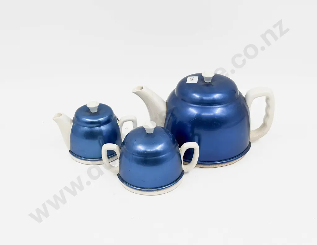 Two Ceramic Teapots and Sugar Basket with Vintage Metal Cosies Image 1++