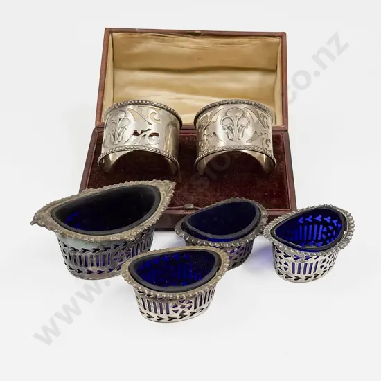 Cased Pair of S/S Napkin Rings with Four Pierced S/S Condiments with Blue Glass Inserts