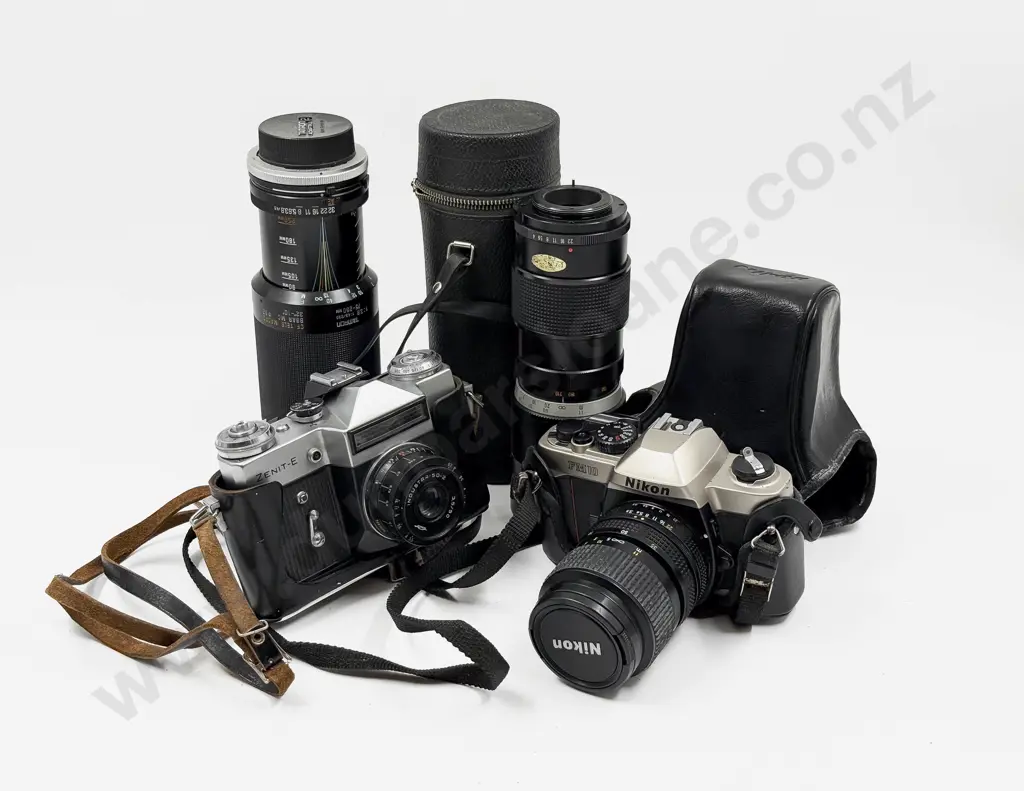 Nikon Camera With Other Camera and Two Associated Lenses Image 1++