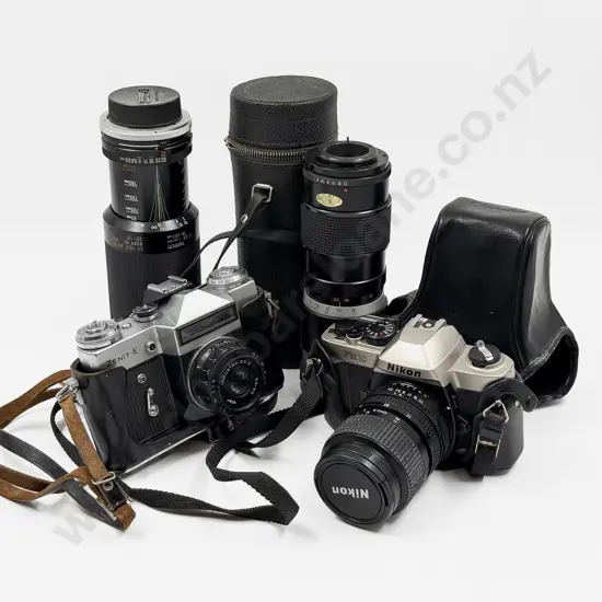 Nikon Camera With Other Camera and Two Associated Lenses