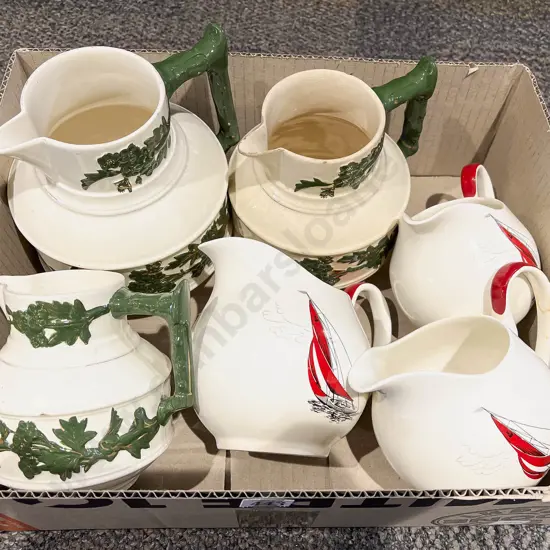 Three Palissy Jugs and Other Graduated Set of Three Jugs