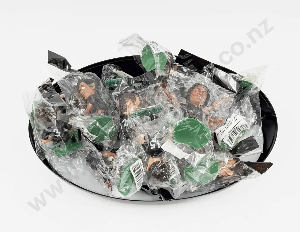 All Black Figures in Rugby Ball Container Image 1++