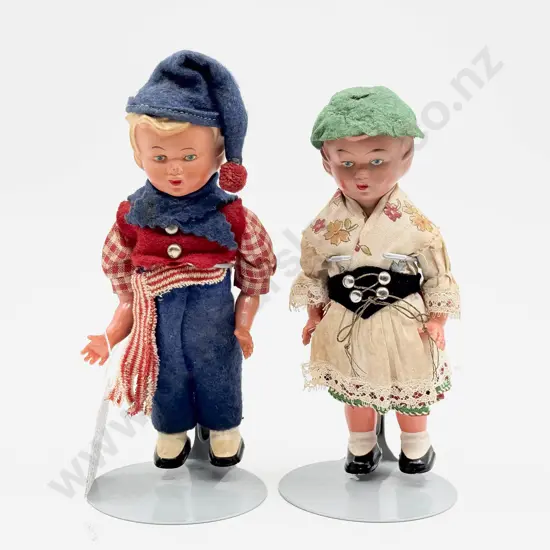 Two Clockwork Dancing Hard Plastic National Costume Dolls