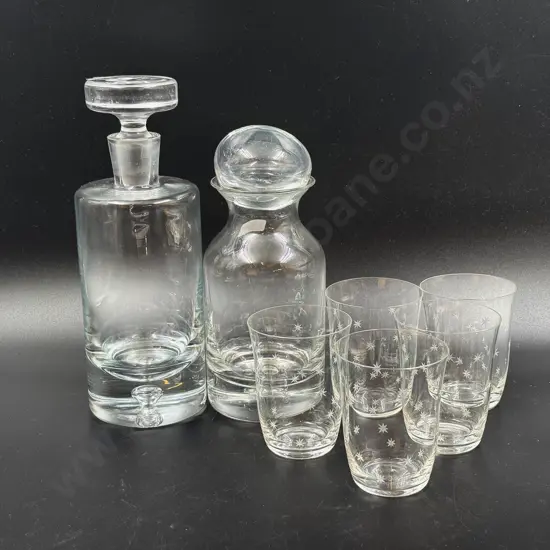 Two Glass Decanters together with Five Etched Glass Cups