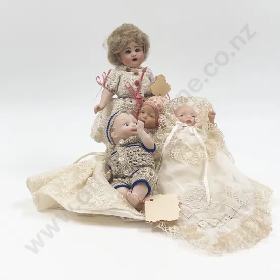 Four Small New Bisque Dolls