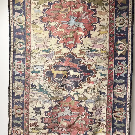 Persian Floor Rug with Allover Animal Motifs inside a Lotus Border