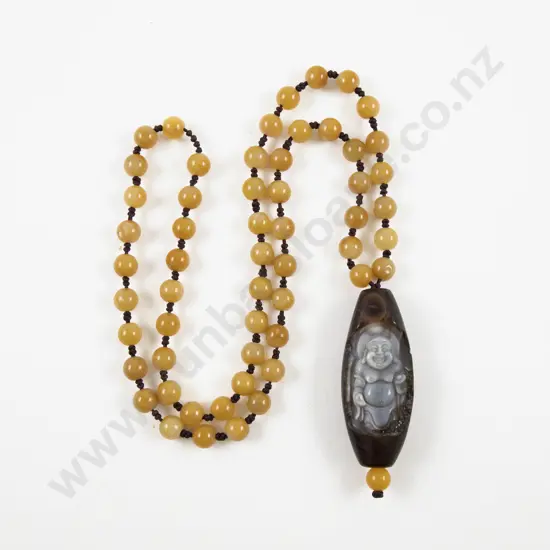 Carved Agate Buddha Pendant on Single Strand Amber Bead Necklace