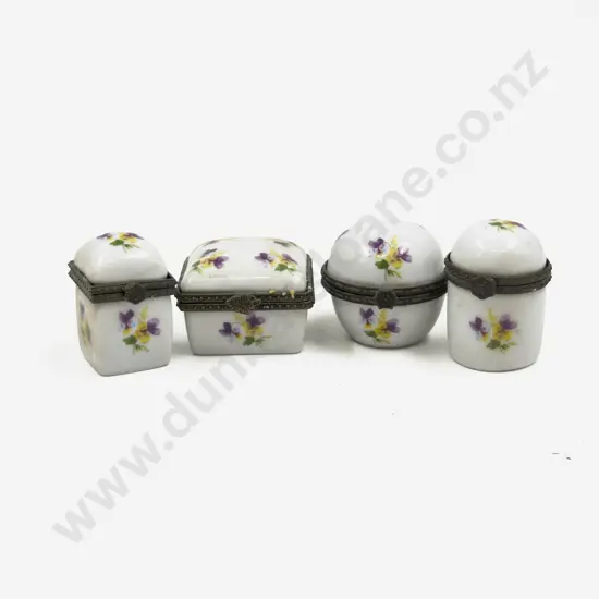 A Cased Set of Four Small Porcelain Trinket Boxes