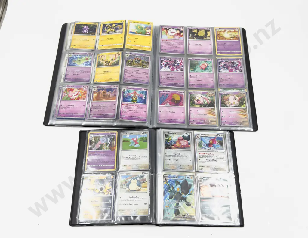 Collection of Assorted Pokemon Cards and Pokemon Folders Image 1++