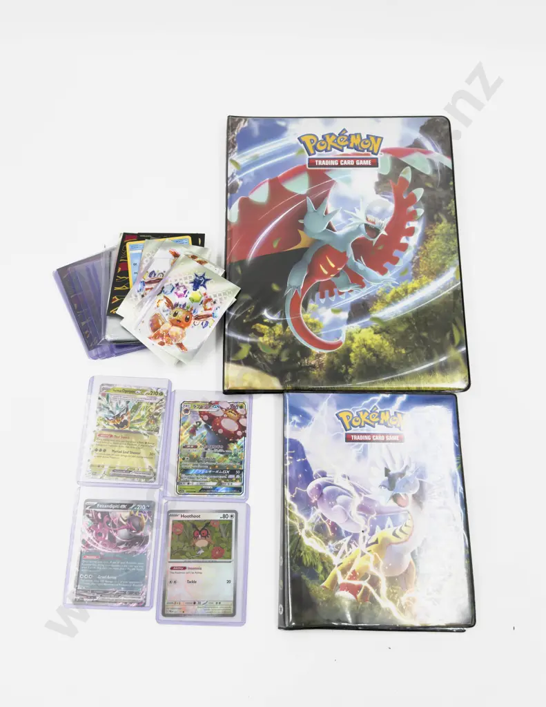 Collection of Assorted Pokemon Cards and Pokemon Folders Image 1++