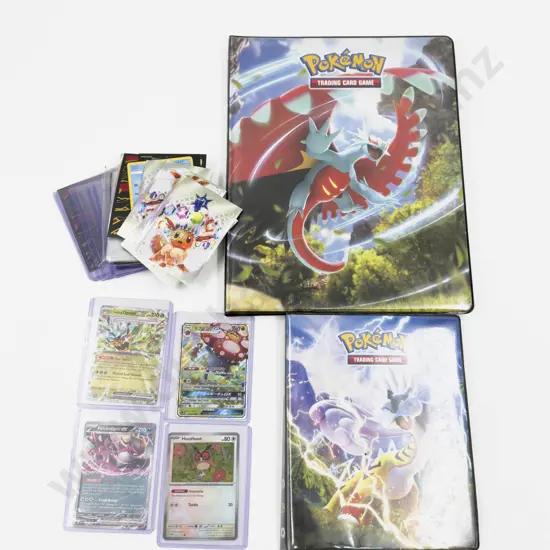 Collection of Assorted Pokemon Cards and Pokemon Folders