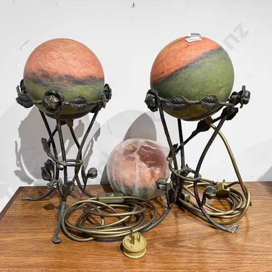 A Pair of Art Glass Orb Lamps on Decorative Metal Stands