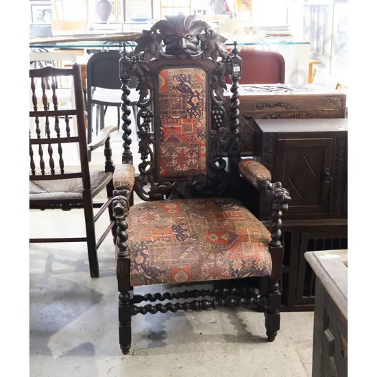 A Victorian Oak Open Armchair of Baroque Design