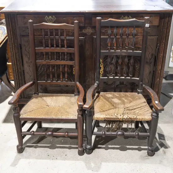 A Near Pair of Geo III Elm Lancashire Open Armchairs
