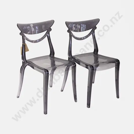 A Pair of Alma Marlene Clear Chairs
