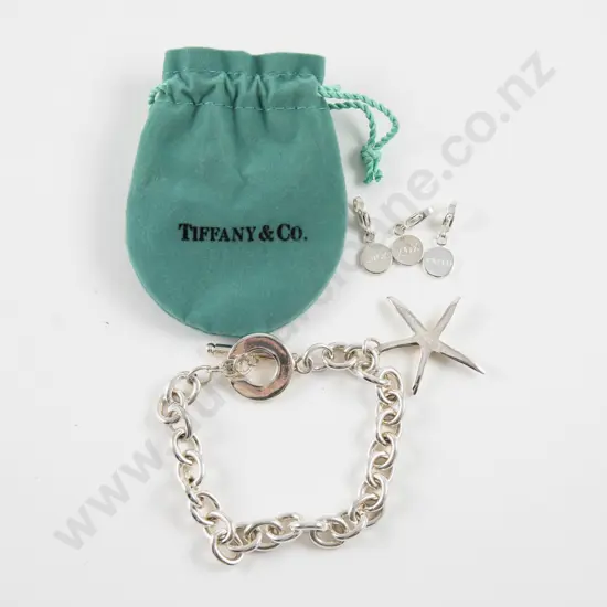 Faux Tiffany and Co S/S Curb Link Bracelet together with Three Charms