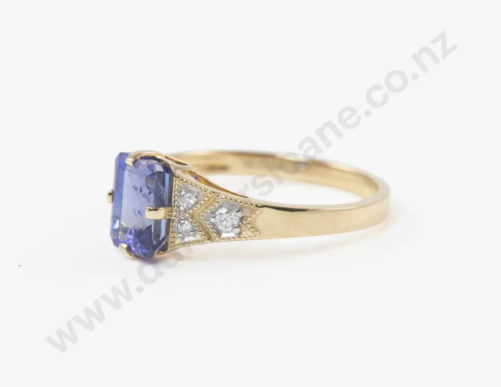 14ct Seven Stone Diamond and Tanzanite Ring central claw set emerald cut tanzanite Image 1++