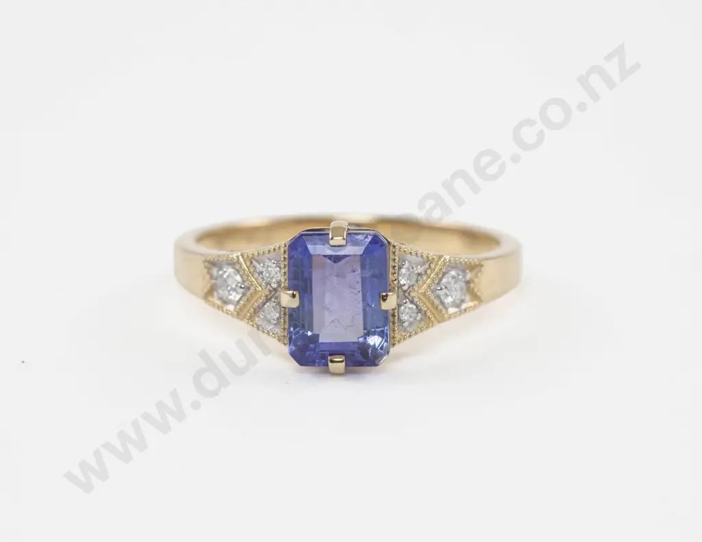 14ct Seven Stone Diamond and Tanzanite Ring central claw set emerald cut tanzanite Image 1++