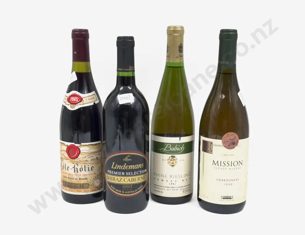 Four Assorted Bottles of Wine Image 1++