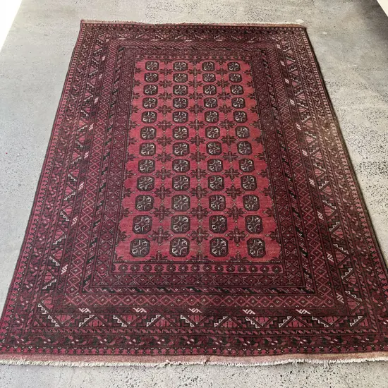 Afghan Turkoman Mauri Gol Floor Rug with Multiple Borders on Faded Red Ground